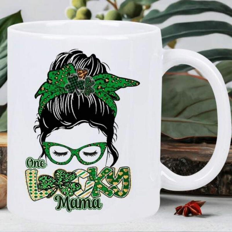 Tailorly White Ceramic 11 oz Mug - One Lucky Mama Festive Messy Bun Featuring Green Clover Headband And Artistic Cat Eye Glasses Woman
