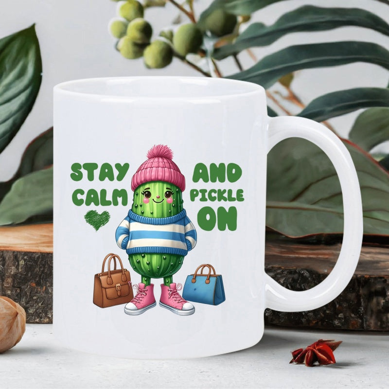 Tailorly White Ceramic 11 oz Mug - Stay Calm And Pickle On Cute Green Character Wearing Winter Clothes Between Colorful Fashion Bags Pickle