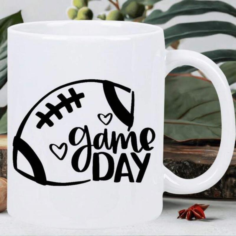 Tailorly White Ceramic 11 oz Mug - Game Day Minimalist Black Ink Silhouette Featuring Two Small Hearts Football