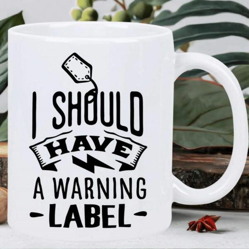 Tailorly White Ceramic 11 oz Mug - I Should Have A Warning Label Minimalist Black Typography Featuring A Banner And A Small Hanging Tag Mug