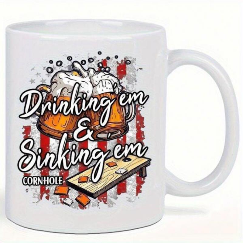 Tailorly White Ceramic 11 oz Mug - Drinking Em Sinking Em Cornhole Two Foaming Beer Mugs Clinking Beside A Slanted Wooden Game Board