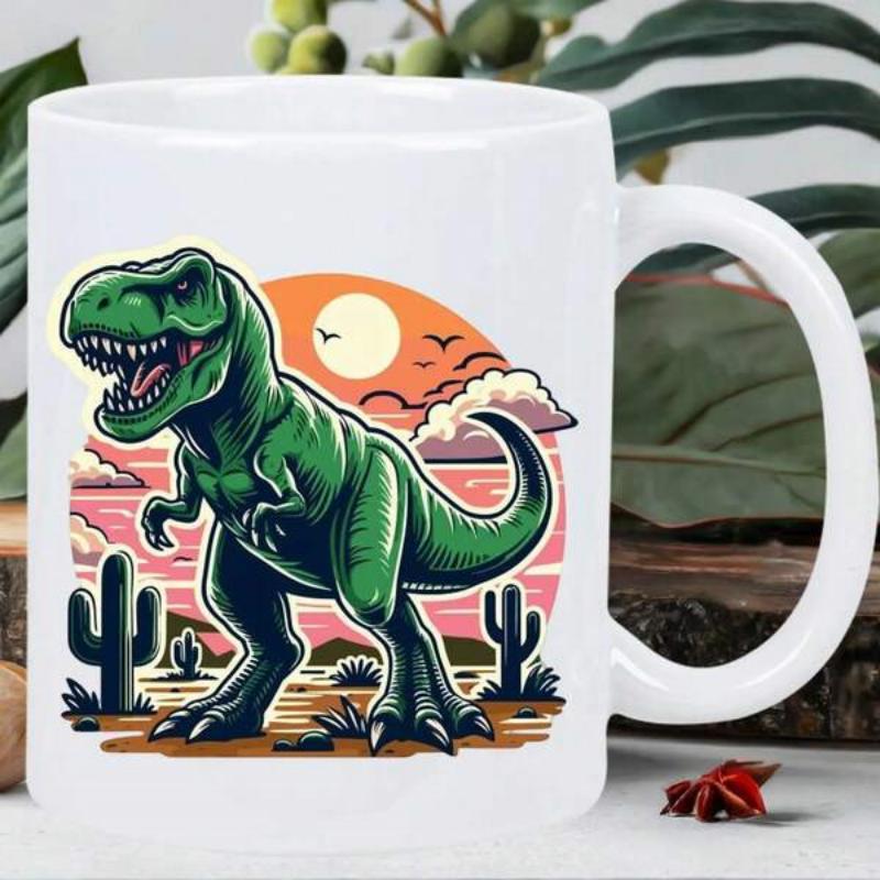 Tailorly White Ceramic 11 oz Mug - Fierce Green Dinosaur Roaring Among Desert Cacti Under A Glowing Orange Sun Tyrannosaurus