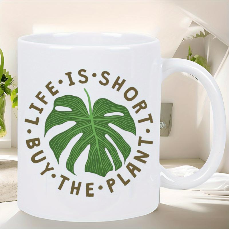 Tailorly White Ceramic 11 oz Mug - Life Is Short Buy The Plant Vibrant Green Monstera Leaf Centered Within Circular Lettering Leaf