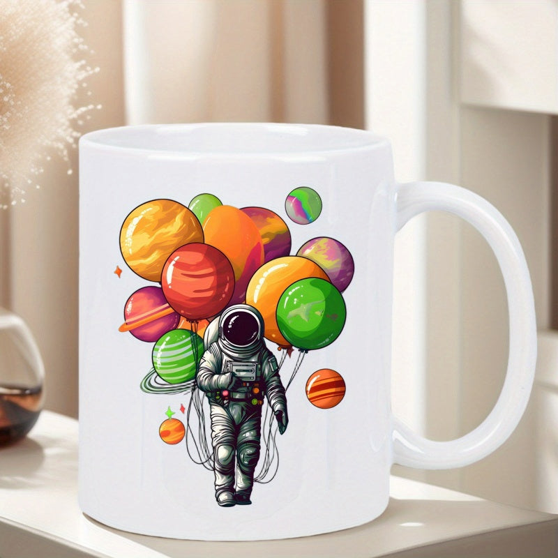 Tailorly White Ceramic 11 oz Mug - Colorful Celestial Planets Floating Above A Grayscale Suit Wearing Astronaut
