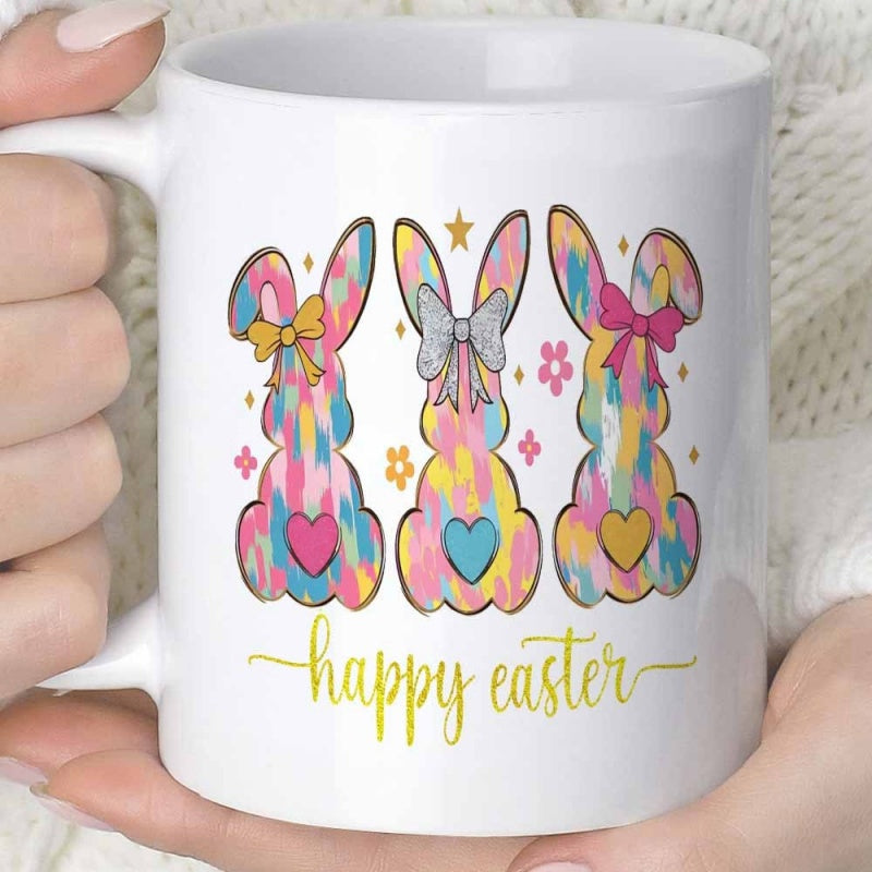 Tailorly White Ceramic 11 oz Mug - Happy Easter Three Tie Dye Pastel Silhouettes Wearing Colorful Bows Among Little Flowers Bunny