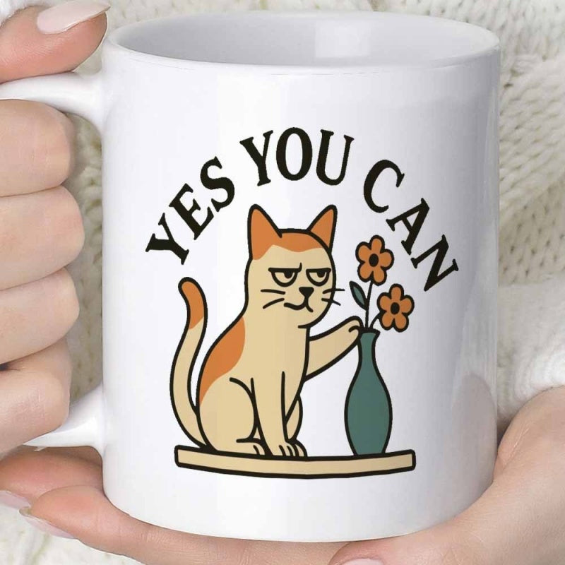Tailorly White Ceramic 11 oz Mug - Yes You Can Sassy Orange Grumpy Cat Pushing Green Flower Vase From Table Surface Cat