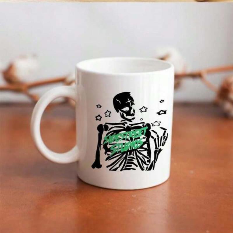 Tailorly White Ceramic 11 oz Mug - Intricate Black Line Art Skeleton Torso Featuring Vibrant Green Heart Shape Skeleton