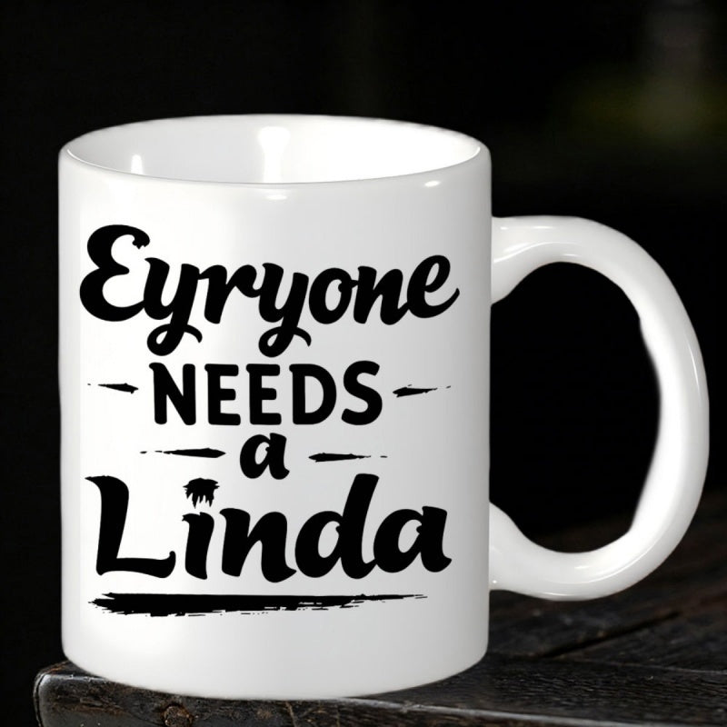 Tailorly White Ceramic 11 oz Mug - Evryone Needs A Linda Bold Black Calligraphy Style With Elegant Swashes And Artistic Script Message