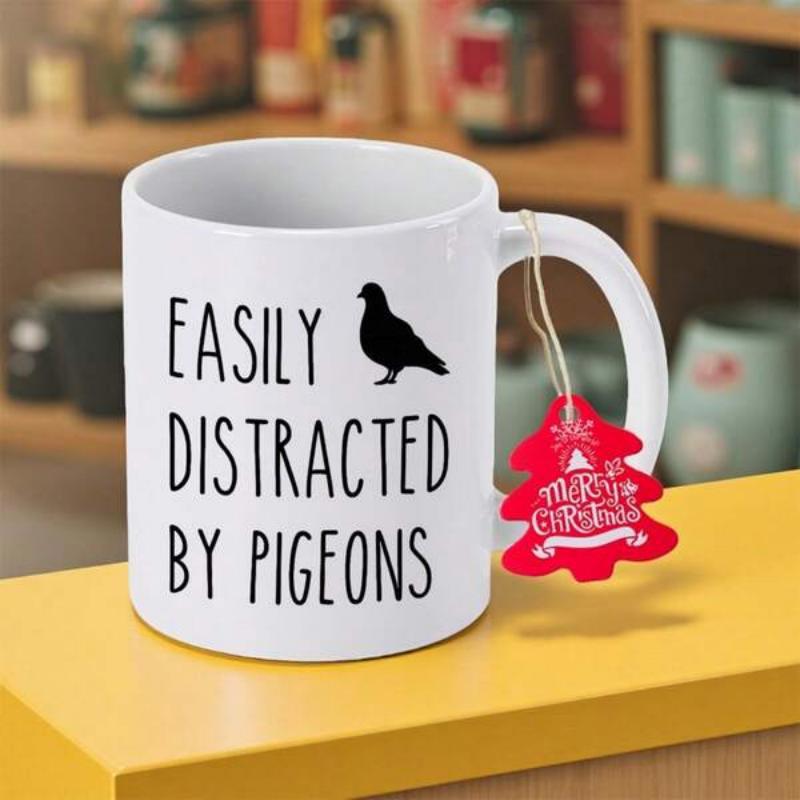Tailorly White Ceramic 11 oz Mug - Easily Distracted By Pigeons Simple Black Bird Silhouette Sitting Quietly Above Playful Tall Lettering Design Pigeon