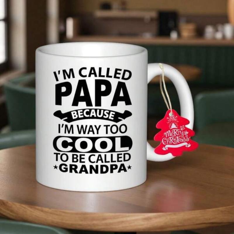 Tailorly White Ceramic 11 oz Mug - Im Called Papa Because Im Way Too Cool To Be Called Grandpa White Ceramic Coffee Cup Resting On Smooth Dark Natural Wood Mug