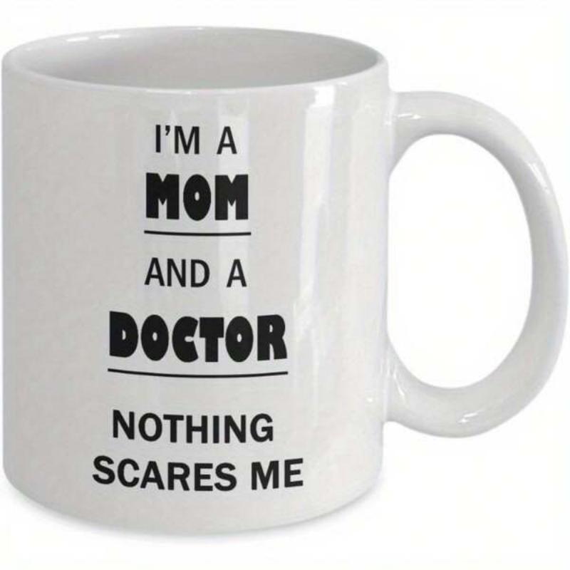 Tailorly White Ceramic 11 oz Mug - I'm A Mom And A Doctor Nothing Scares Me Plain White Ceramic Coffee Cup With Circular Handle And Simple Black Text Mug