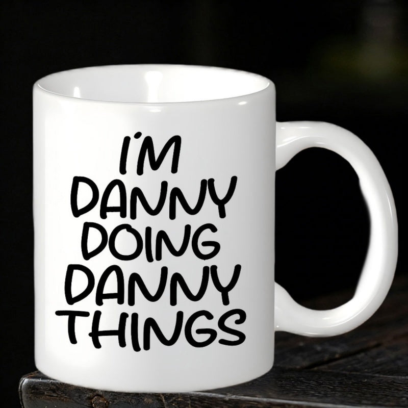 Tailorly White Ceramic 11 oz Mug - Im Danny Doing Danny Things Clean White Ceramic Vessel Standing On Dark Wooden Surface Mug
