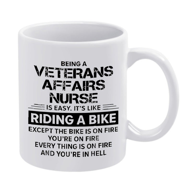 Tailorly White Ceramic 11 oz Mug - Being A Veterans Affairs Nurse Is Easy Its Like Riding A Bike Except The Bike Is On Fire Youre On Fire Every Thing Is On Fire