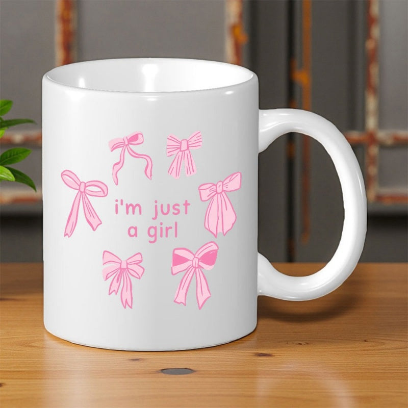 Tailorly White Ceramic 11 oz Mug - Im Just A Girl Delicate Pink Ribbons Scattered Around Soft Pink Minimalist Script Text Bow
