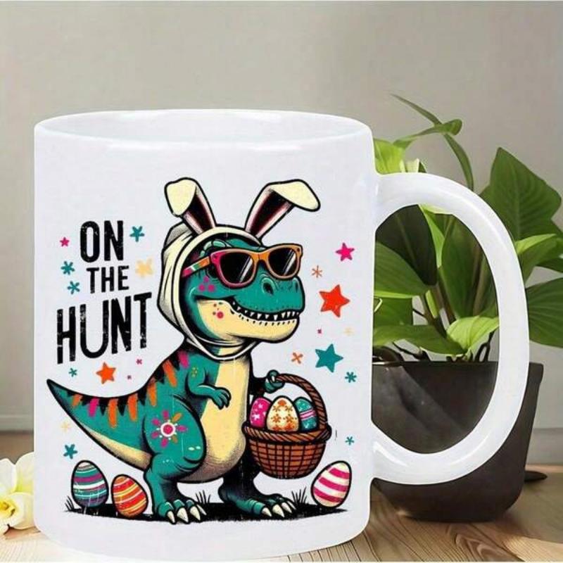 Tailorly White Ceramic 11 oz Mug - On The Hunt Green Creature Wearing Bunny Ears Carrying A Colorful Egg Basket Among Stars Dinosaur