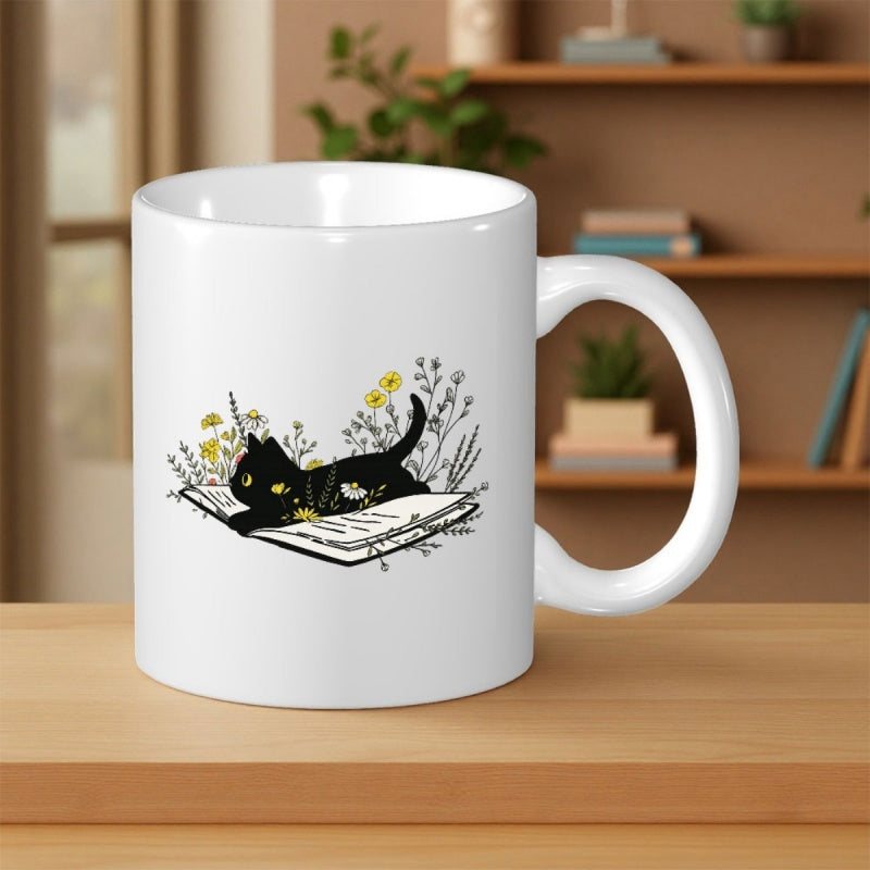 Tailorly White Ceramic 11 oz Mug - Graceful Black Cat Resting Peacefully Atop Open Book Surrounded By Wildflowers Cat