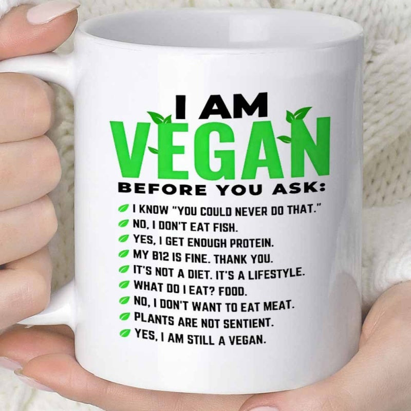 Tailorly White Ceramic 11 oz Mug - I Am Vegan Before You Ask Minimalist Green Leaves Floating Gently Above Bold Capitalized Typography Mug