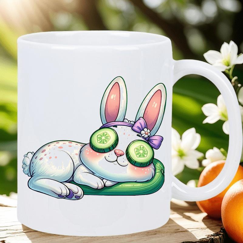 Tailorly White Ceramic 11 oz Mug - Adorable Cartoon Bunny Resting On Green Cushion With Cucumber Eye Treatment Rabbit