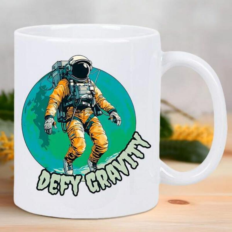 Tailorly White Ceramic 11 oz Mug - Defy Gravity Floating In Deep Space Background Within A Vibrant Green Planetary Circle Astronaut