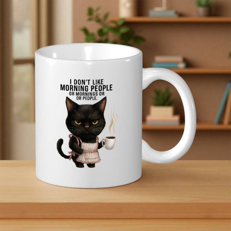 Tailorly White Ceramic 11 oz Mug - I Don't Like Morning People Or Mornings Or People Grumpy Black Cat Wearing Pink Apron Holding A Steaming Cup Of Coffee Cat