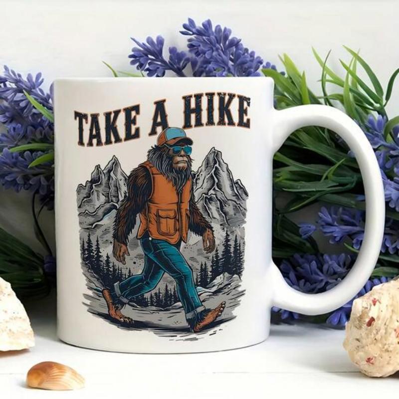 Tailorly White Ceramic 11 oz Mug - Take A Hike Bigfoot Wearing Hiking Gear Walking Through Majestic Mountains And Evergreen Forest Bigfoot