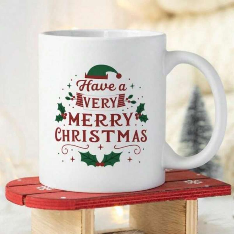 Tailorly White Ceramic 11 oz Mug - Have A Very Merry Christmas Festive Ceramic Surface Featuring Green Elf Hat And Holly Leaves Mug