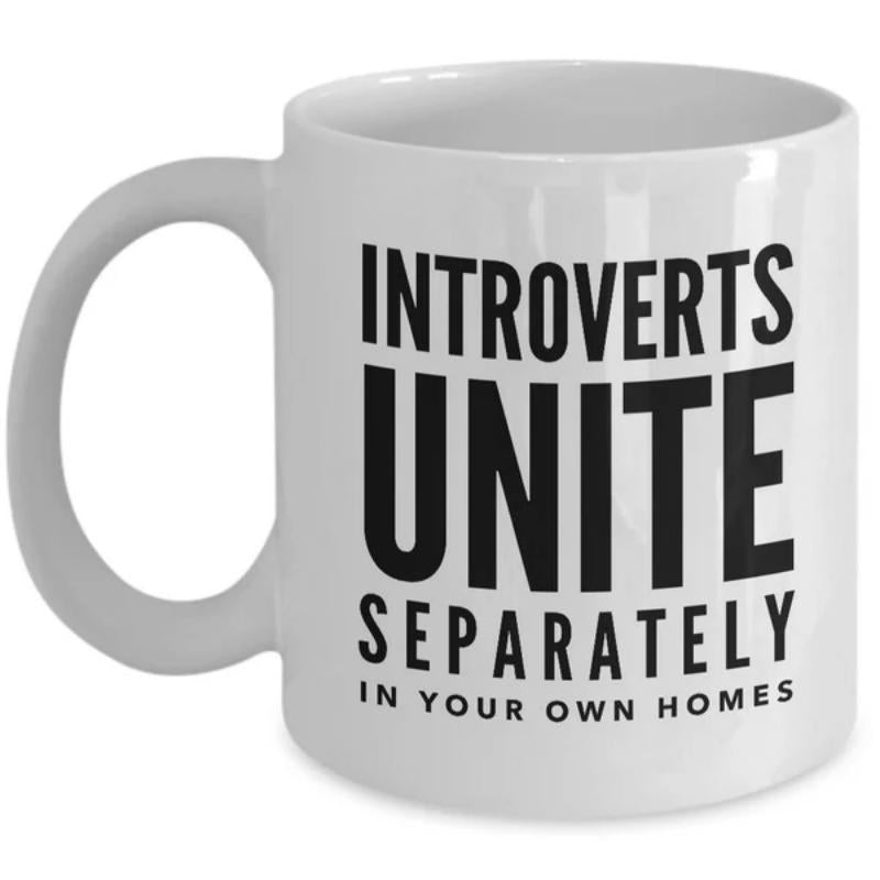Tailorly White Ceramic 11 oz Mug - Introverts Unite Separately In Your Own Homes Simple Minimalist Style Featuring Bold Black Block Letters On White Surface Mug