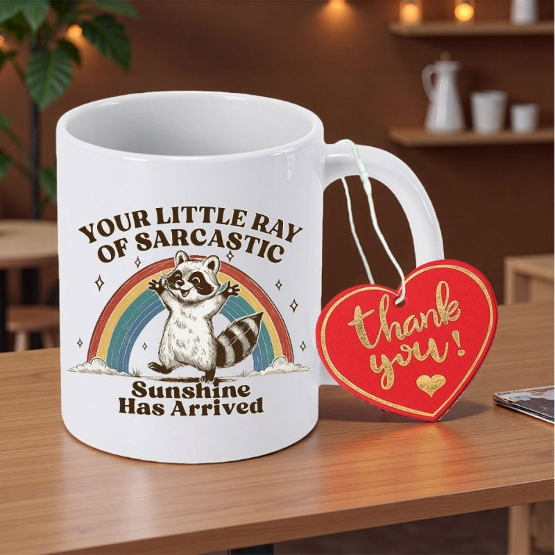 Tailorly White Ceramic 11 oz Mug - Your Little Ray Of Sarcastic Sunshine Has Arrived Adorable Cartoon Raccoon Standing Joyfully Before A Colorful Vibrant Vintage