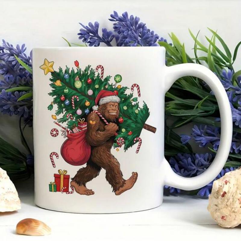 Tailorly White Ceramic 11 oz Mug - Festive Christmas Sasquatch Carrying Decorated Evergreen Tree And Red Sack Bigfoot