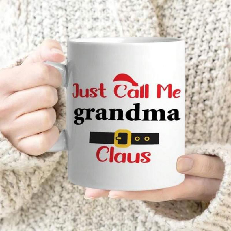 Tailorly White Ceramic 11 oz Mug - Just Call Me Grandma Claus Festive Red Holiday Hat Above A Black Belt With Gold Buckle Mug