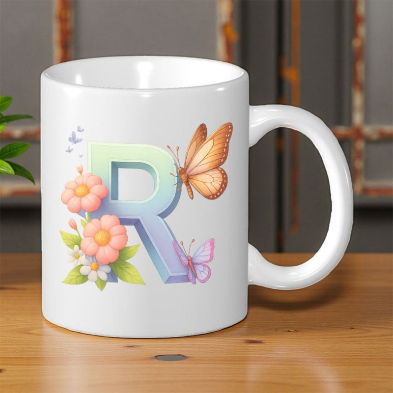 Tailorly White Ceramic 11 oz Mug - R Elegant Gradient Design Surrounded By Orange Butterflies And Blooming Pink Blossoms Alphabet