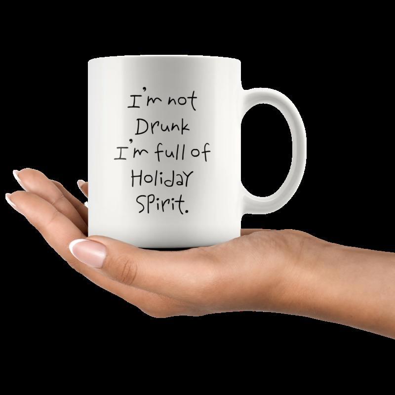 Tailorly White Ceramic 11 oz Mug - Im Not Drunk Im Full Of Holiday Spirit Minimalist White Ceramic Vessel Held Gently By Human Hand In Dark Room Mug