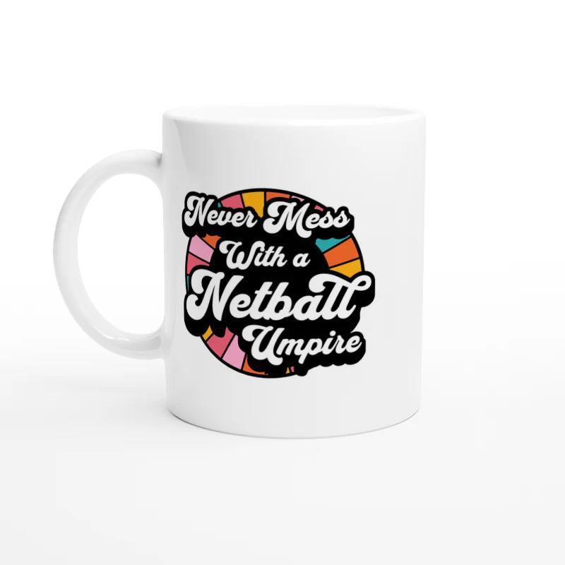 Tailorly White Ceramic 11 oz Mug - Never Mess With A Netball Umpire Retro Colorful Radiant Circle Background With Bold Script Styling Emblem