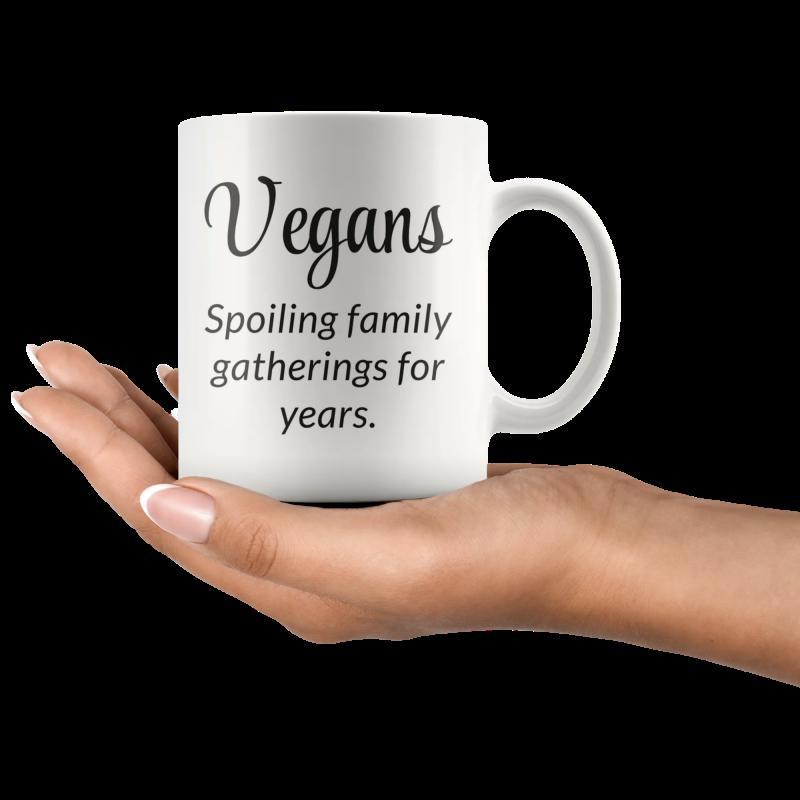 Tailorly White Ceramic 11 oz Mug - Vegans Spoiling Family Gatherings For Years Simple Minimalist White Surface Held By A Human Hand Mug