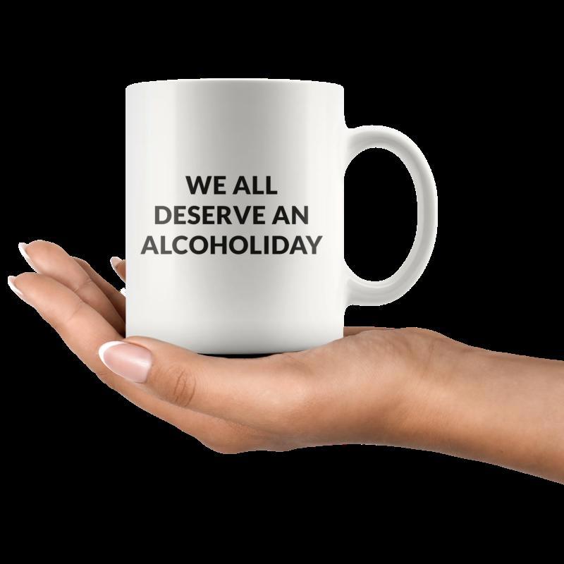 Tailorly White Ceramic 11 oz Mug - We All Deserve An Alcoholiday Human Hand Carefully Holding A Minimalist White Ceramic Beverage Mug
