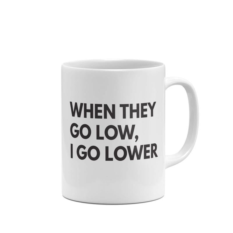 Tailorly White Ceramic 11 oz Mug - When They Go Low I Go Lower Minimalist Clean Ceramic Kitchenware Standing On Plain White Surface Mug