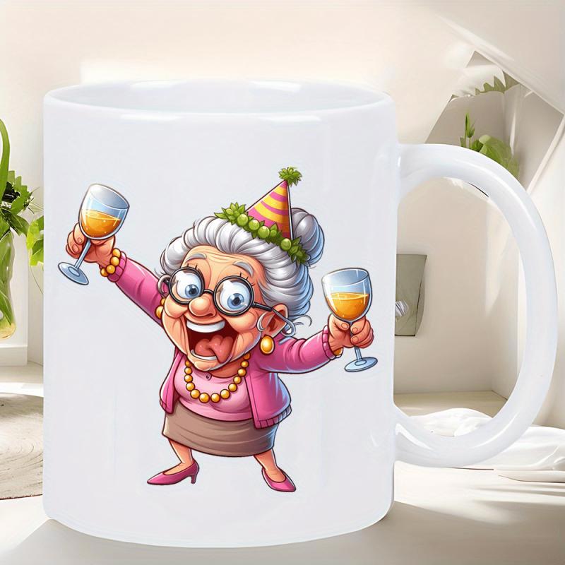 Tailorly White Ceramic 11 oz Mug - Cheerful Elderly Woman Holding Wine Glasses Wearing A Festive Party Hat Grandma