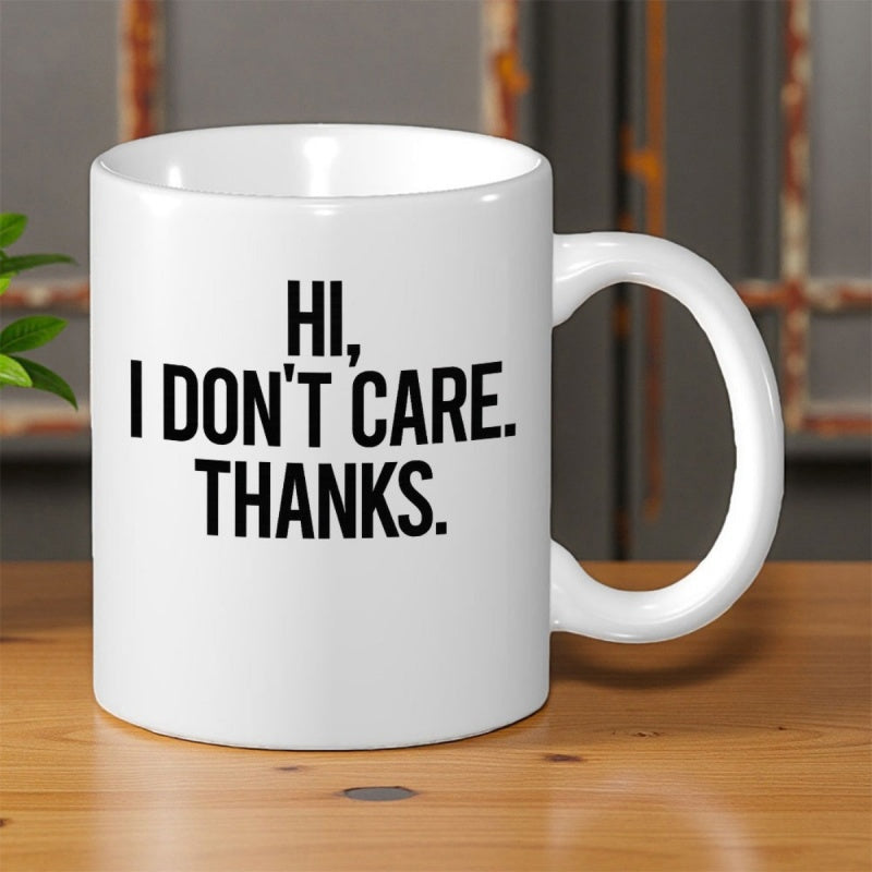 Tailorly White Ceramic 11 oz Mug - Hi I Don't Care Thanks Minimalist Sleek Ceramic Kitchenware Sitting On A Polished Wooden Surface Mug