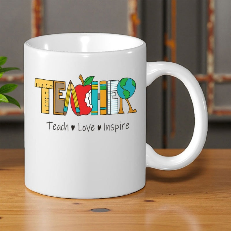 Tailorly White Ceramic 11 oz Mug - Teach Love Inspire Creative School Supplies Forming Letters With Apple And Rotating Globe Mug