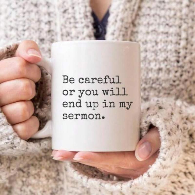 Tailorly White Ceramic 11 oz Mug - Be Careful Or You Will End Up In My Sermon Minimalist White Ceramic Held By Hands In Cozy Sweater Mug