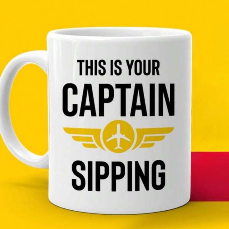 Tailorly White Ceramic 11 oz Mug - This Is Your Captain Sipping Stylized Golden Aviation Wings Emblem Featuring A Small Central Aircraft Mug