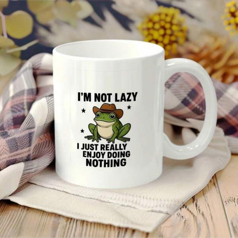 Tailorly White Ceramic 11 oz Mug - Im Not Lazy I Just Really Enjoy Doing Nothing Green Cartoon Creature Wearing A Brown Cowboy Hat Sitting Calmly Frog