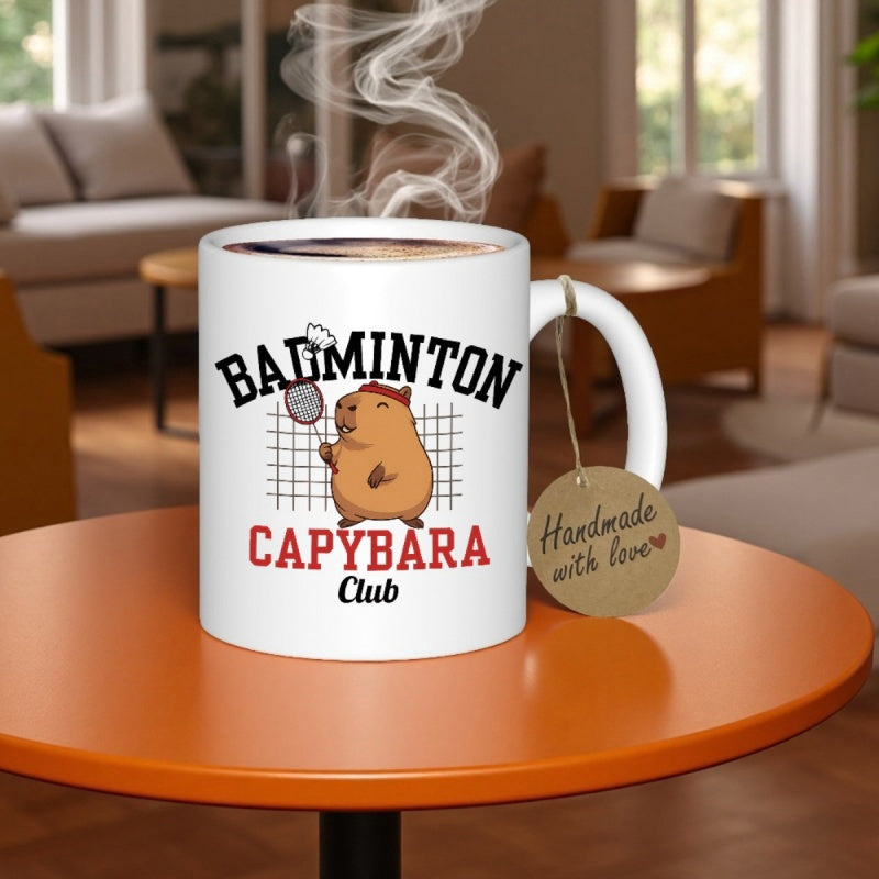 Tailorly White Ceramic 11 oz Mug - Badminton Capybara Club Playful Cartoon Animal Holding A Racket Before Sport Net Capybara