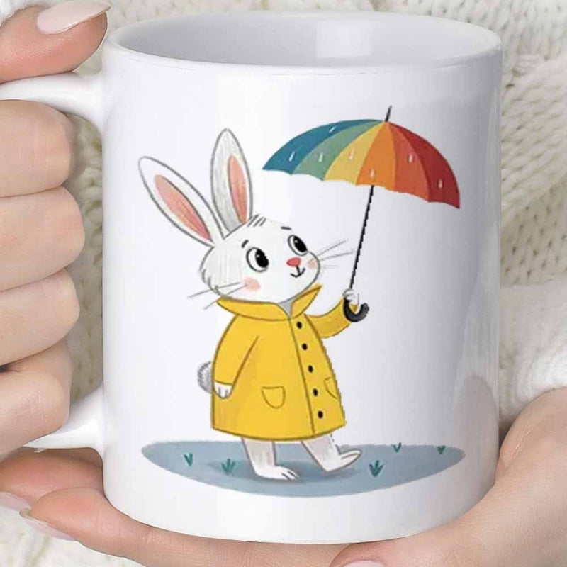 Tailorly White Ceramic 11 oz Mug - Adorable White Rabbit Wearing Yellow Raincoat Holding A Colorful Rainbow Umbrella Rabbit