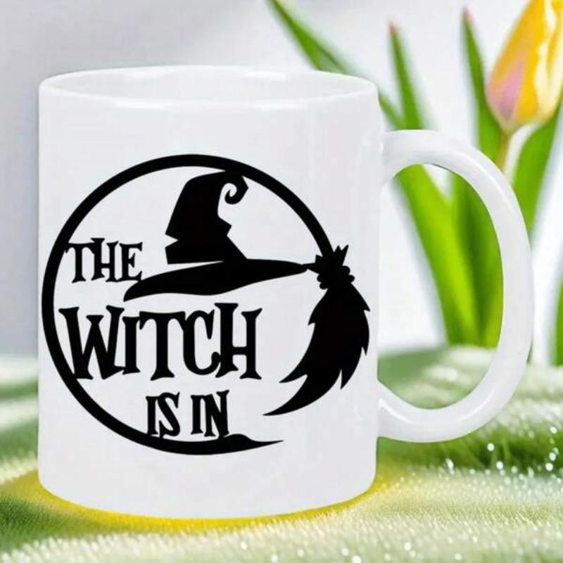 Tailorly White Ceramic 11 oz Mug - The Witch Is In Black Silhouette Of Broomstick Within A Spooky Circular Frame Witch Hat