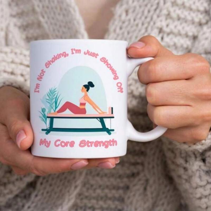 Tailorly White Ceramic 11 oz Mug - Im Not Shaking Im Just Showing Off My Core Strength Graceful Woman Practicing Pilates On A Reformer With Tropical Plants