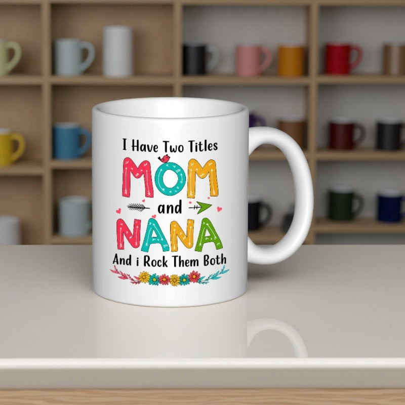 Tailorly White Ceramic 11 oz Mug - I Have Two Titles Mom And Nana And I Rock Them Both Colorful Artistic Text Featuring Floral Decoration And Flying Small Bird