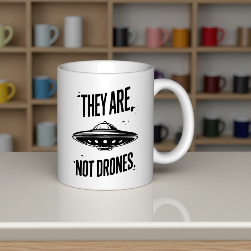 Tailorly White Ceramic 11 oz Mug - They Are Not Drones Classic Saucer Shaped Spacecraft Floating In Empty Space Above Slogan UFO
