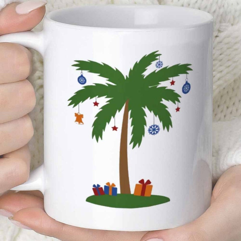 Tailorly White Ceramic 11 oz Mug - Tropical Festive Holiday Ornaments Hanging From Lush Green Branches With Gifts Palm Tree