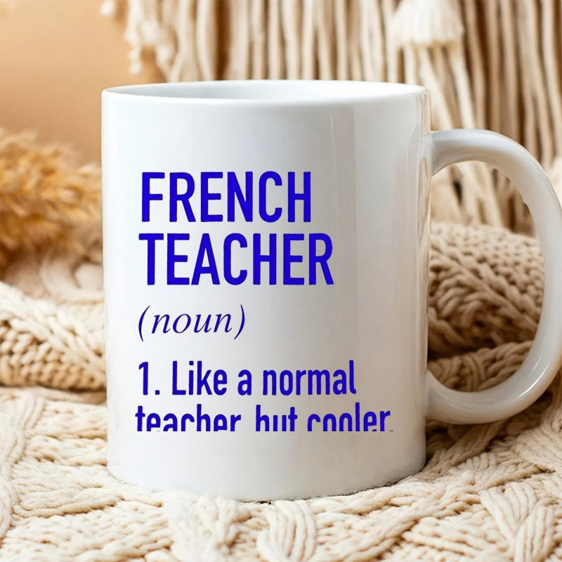 Tailorly White Ceramic 11 oz Mug - French Teacher Noun Like A Normal Teacher But Cooler Minimalist White Ceramic Vessel Resting Upon Textured Woven Blanket Mug